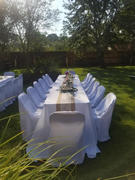 tableclothsfactory.com White Polyester Folding Flat Chair Covers, Reusable or 1x Use Stain Resistant Chair Covers Review