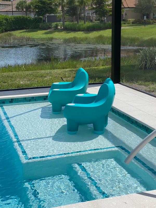 Chairs by the online pool