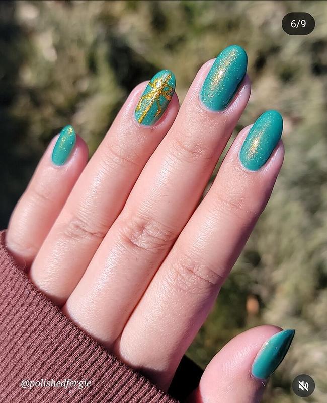 Turquoise green nail polish with multidimensional gold to green