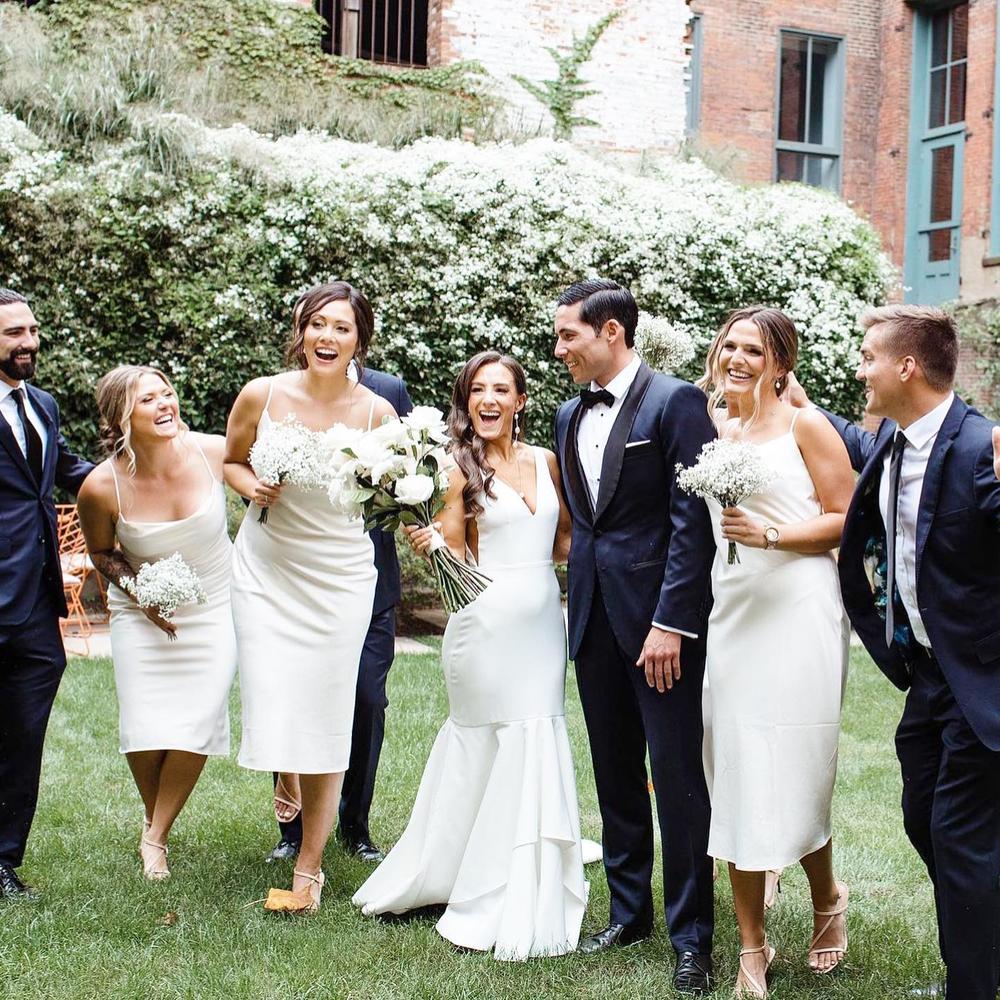Congrats to influencer 👰🏻♀️ @almazzurco on tying the knot! Her bridesmaids (including fitness blogger @thefitnesslioness) look gorgeous in our Lisa satin slip dress in Champagne 🥂 • PS, we’re relaunching this satin midi in our NEW satin colors later this fall so stay tuned for updates ❤️ • 📸: @dianagalay_photo #birdyinthewold #BIRDYGREY
