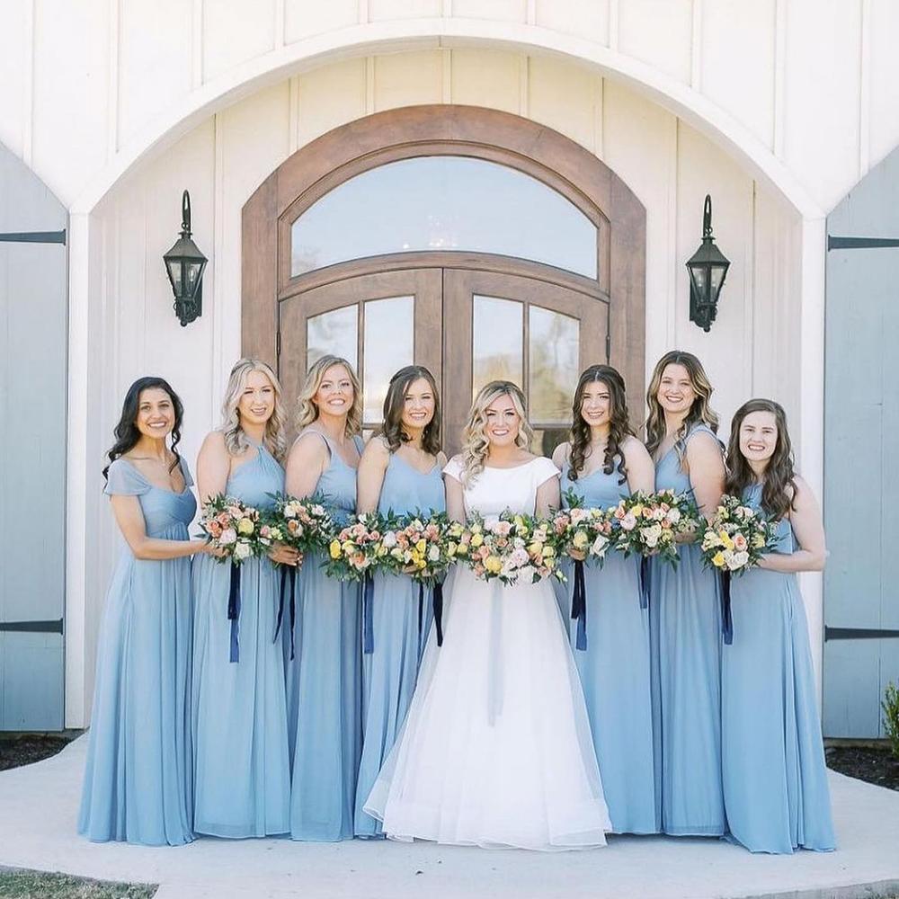 Love this crew in our Dusty Blue 💙 Note the contrasting slate blue ribbon from their bouquets - so chic! • 📸: @bridesofnorthtx 📍: @thefrenchfarmhousevenue #birdyinthewild #BIRDYGREY