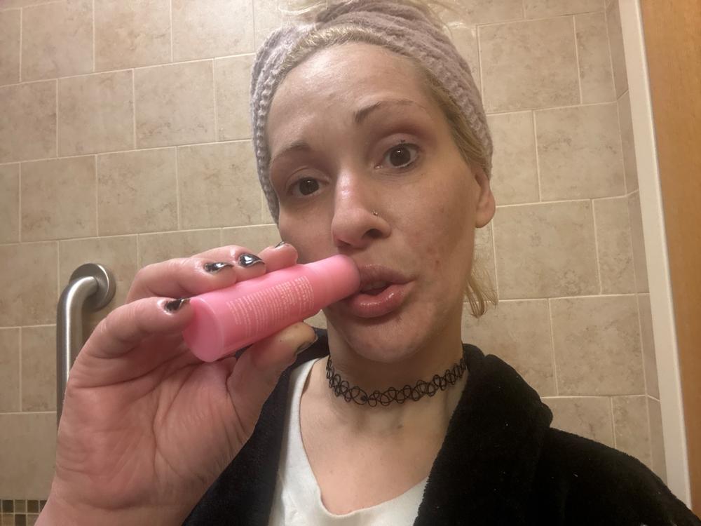 Kelsey applying the pink collagen balm