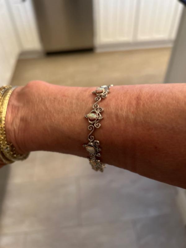 Enchanted Disney Fine Jewelry Sterling Silver and 10K Rose Gold with 1/10 CTTW Diamonds and Created Opal Cinderella Bracelet - Customer Photo From Donnna G.