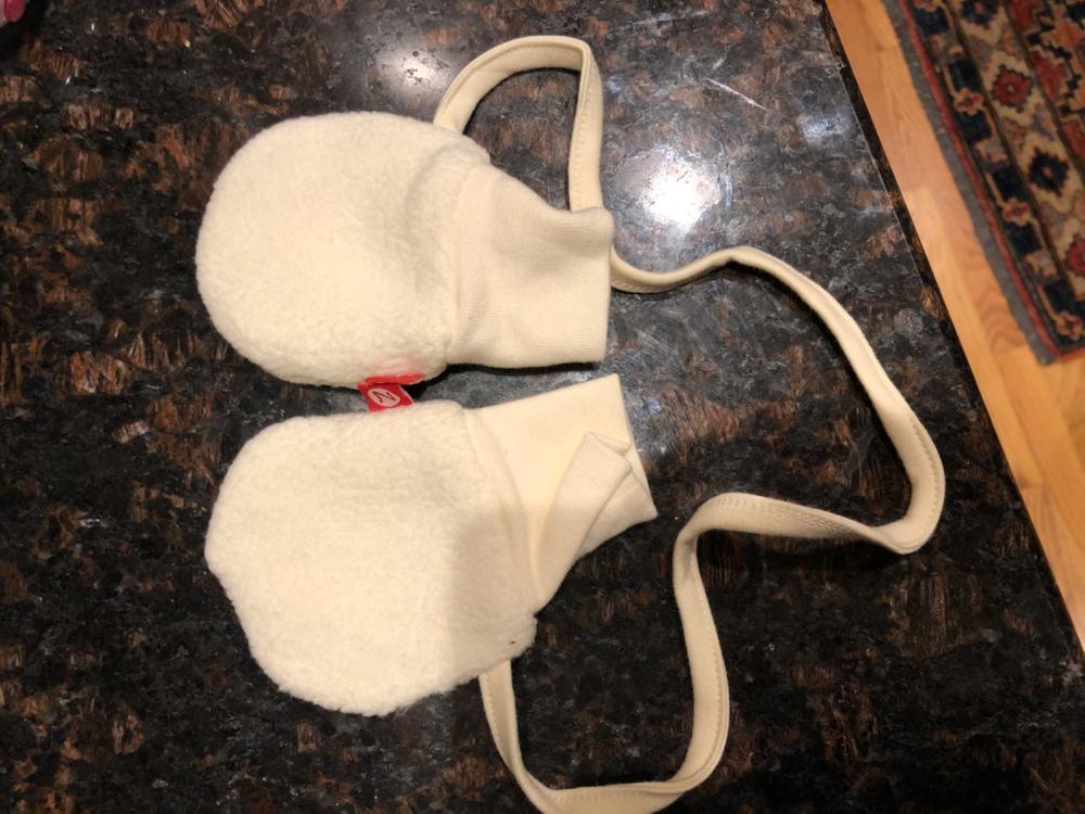 zutano mittens on a string