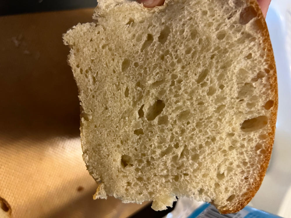 The rise lifted a 777g lid about 2mm. Final loaf weight is 1041g. White  whole wheat, AP and bread flour. Sourdough starter. : r/Sourdough