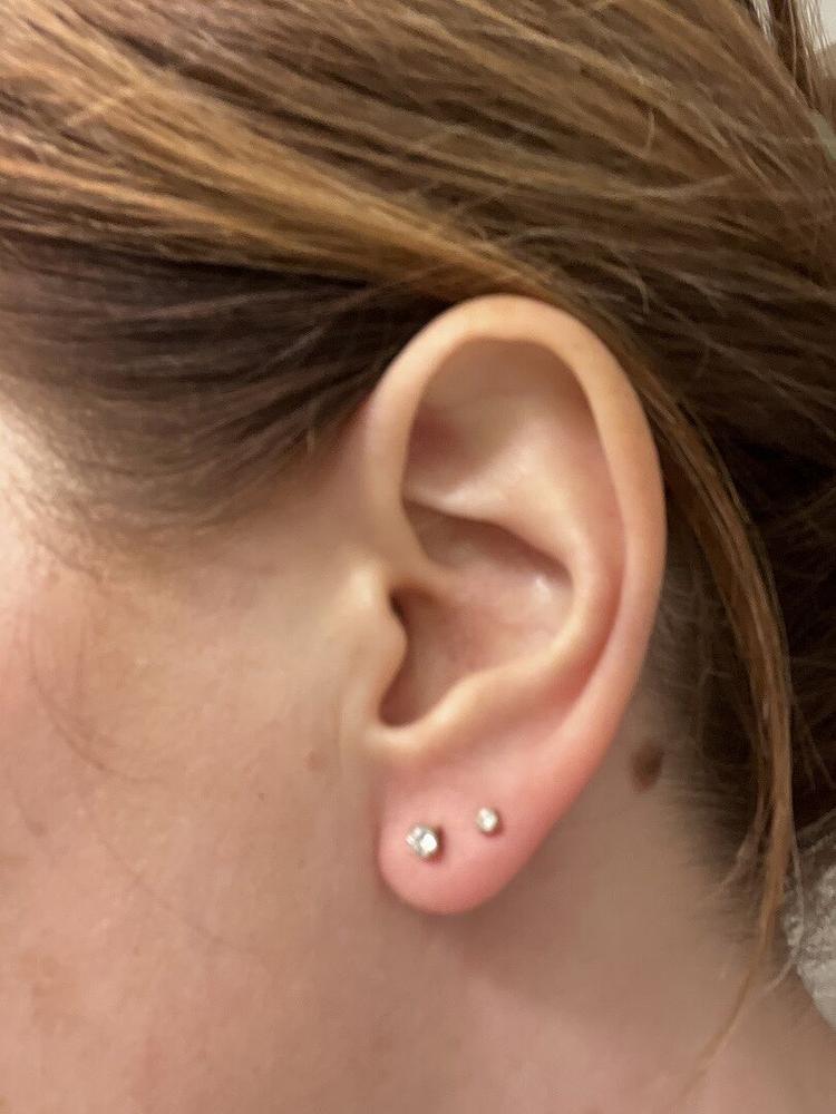 Golden Titanium Prong Set CZ Earrings - Customer Photo From Jennifer s.