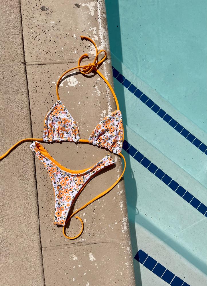 Tangerine Daisies on White Poly Spandex Swimsuit Fabric - Customer Photo From Carolina